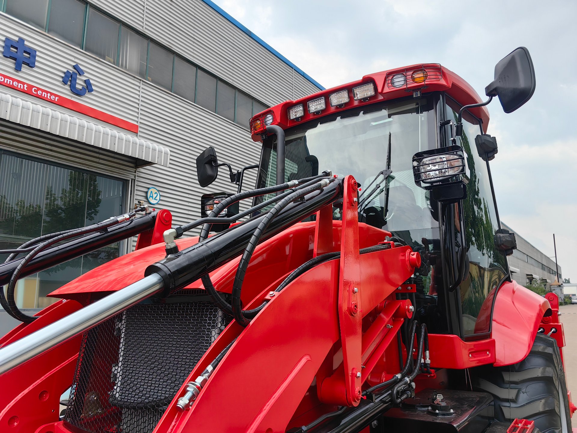 AOLITE backhoe loader at the factory development center