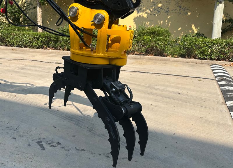 Rotating Wood Clamp attachment for backhoe loader