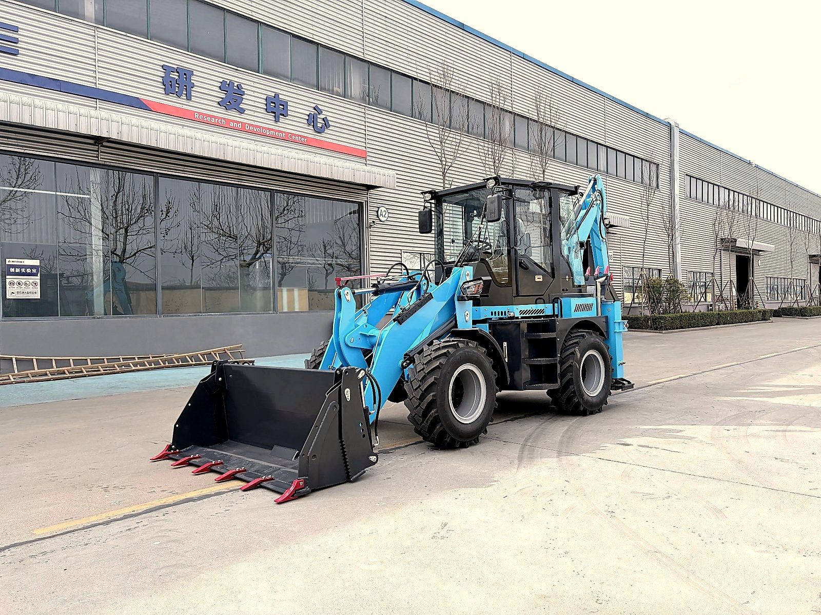Backhoe loader refueling on a construction site