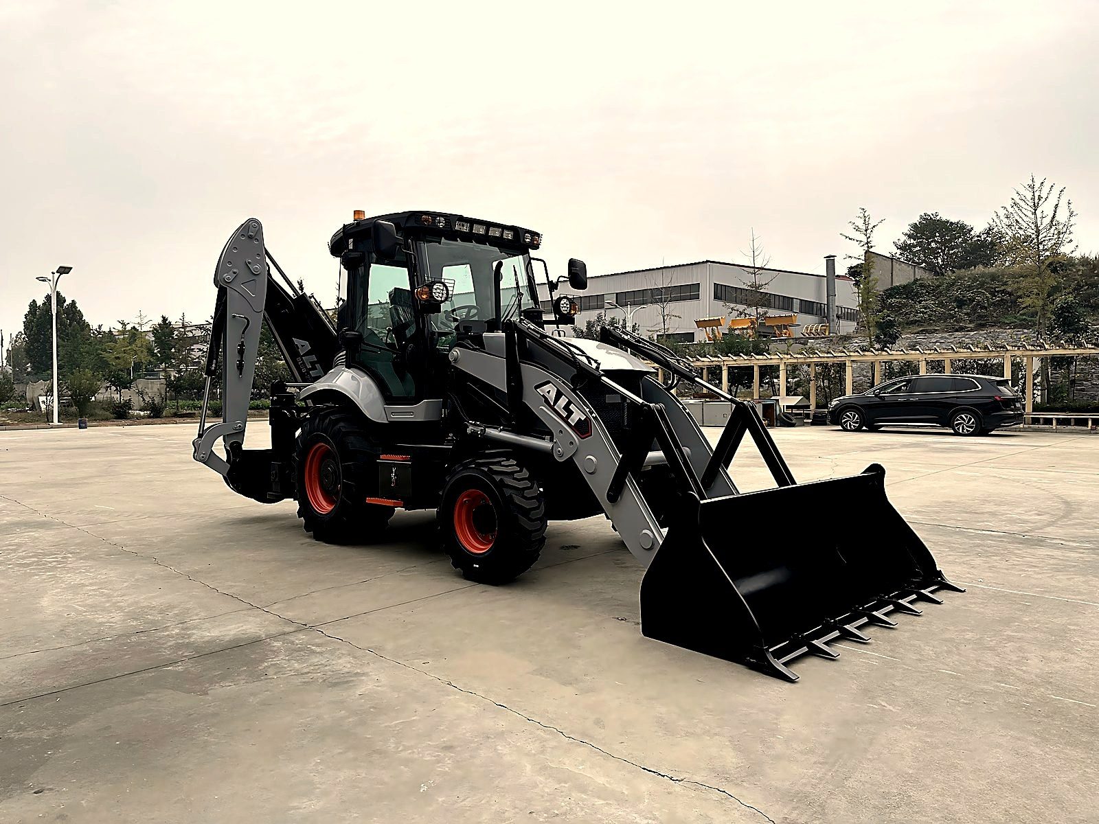 Backhoe loader tire close-up showing tread pattern and condition