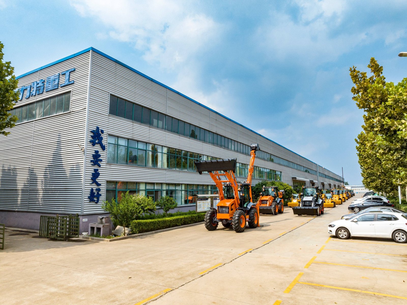 AOLITE factory aerial view with backhoe loaders