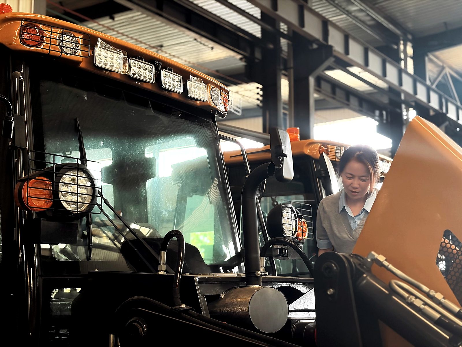 Vivian inspecting the BL 80-25 cab area for engine plate verification