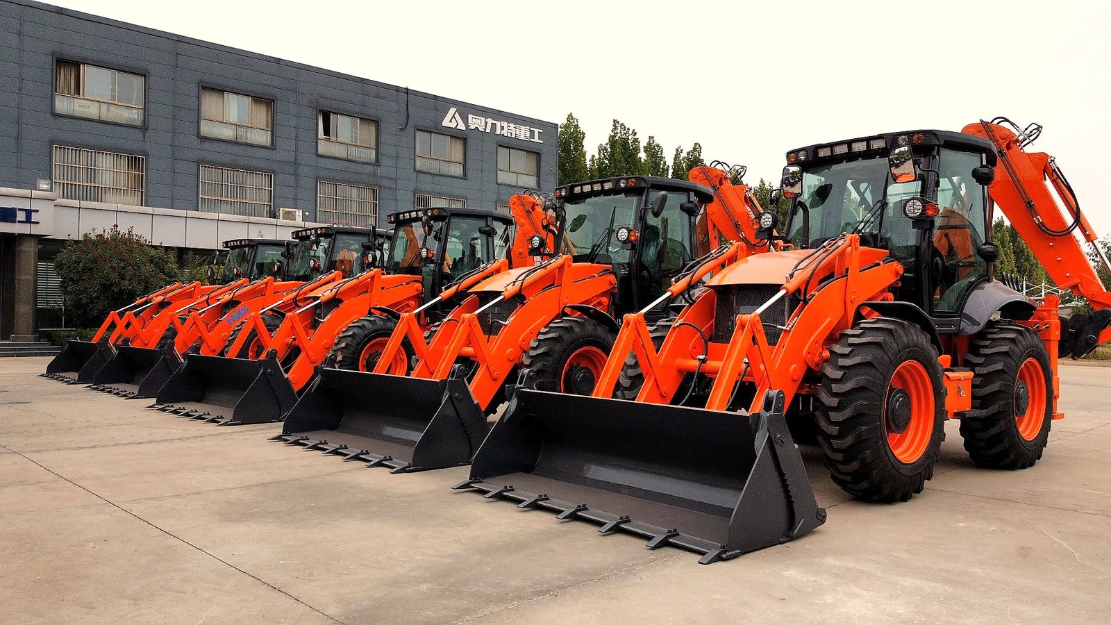 Vivian at factory — backhoe loader