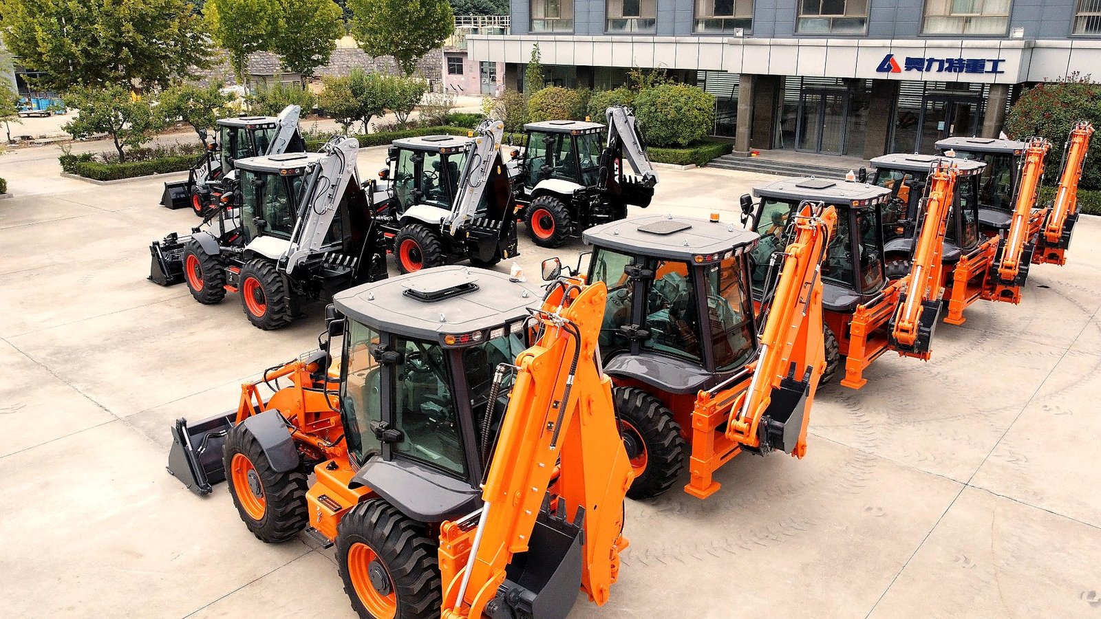 At factory — backhoe loader