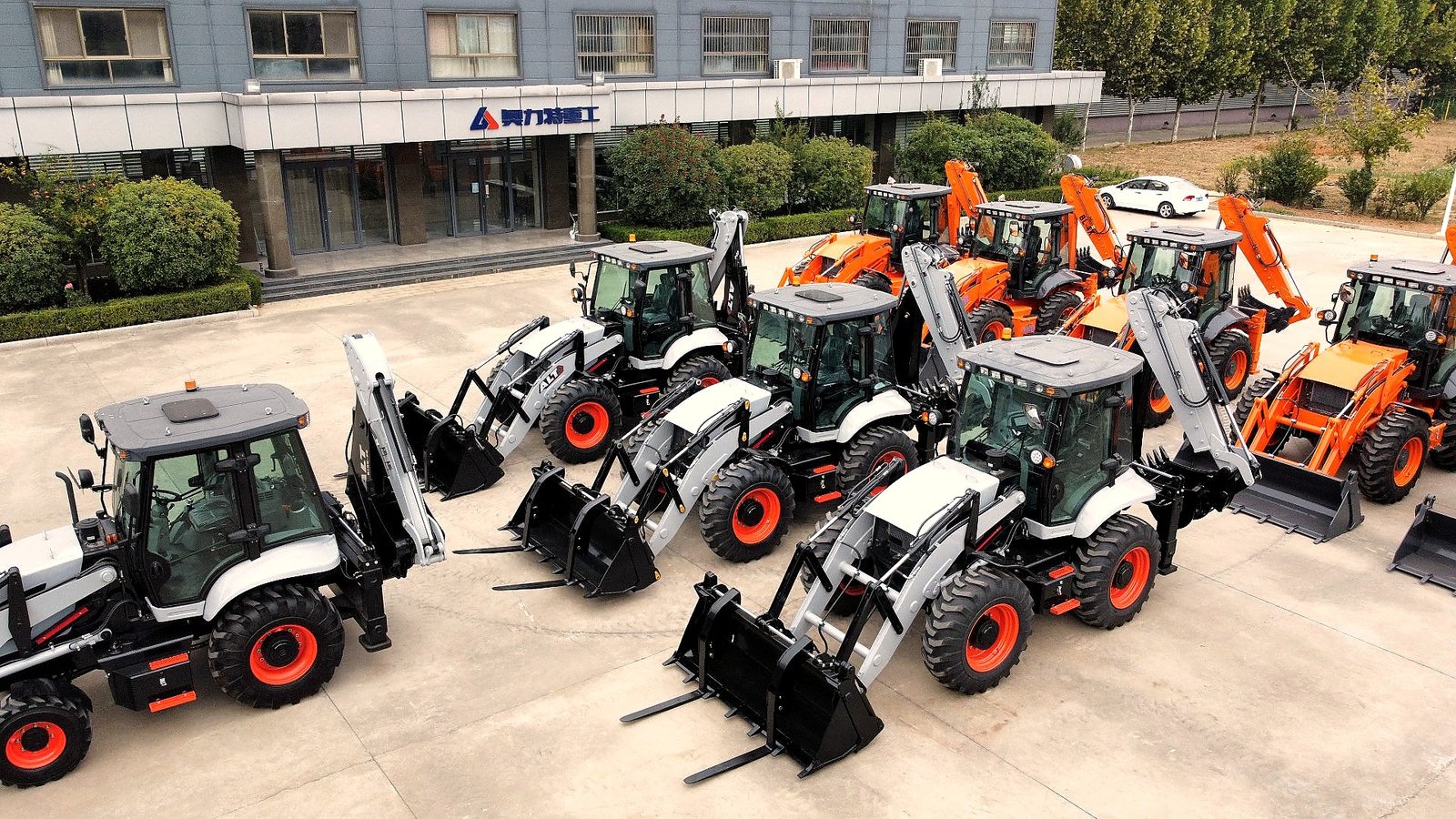 Vivian at factory — backhoe loader