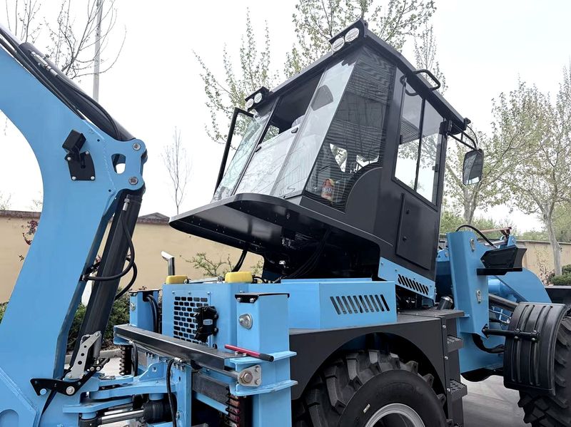 Backhoe loader cab and exterior detail