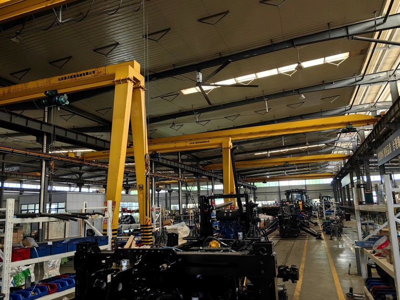 Backhoe loader assembly line in the workshop